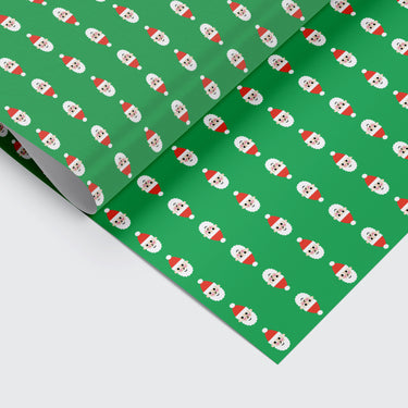 Christmas wrapping paper with santa pattern on it